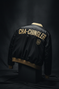 Cha-Chingler Bomber Jacket – black satin with gold ribbing and CHA-CHINGLER back embroidery